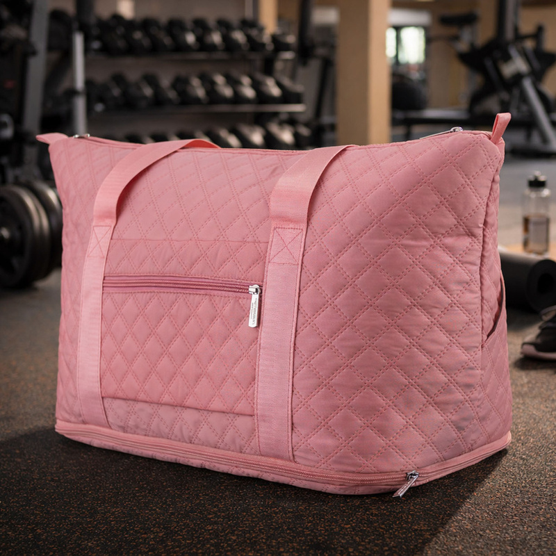 Treningowa torba wykonana z poliestru w różowym kolorze, zawieszona na wygodnych uchwytach - Peterson