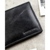 Czarny portfel męski ze skóry naturalnej bez zapięcia zewnętrznego - Peterson